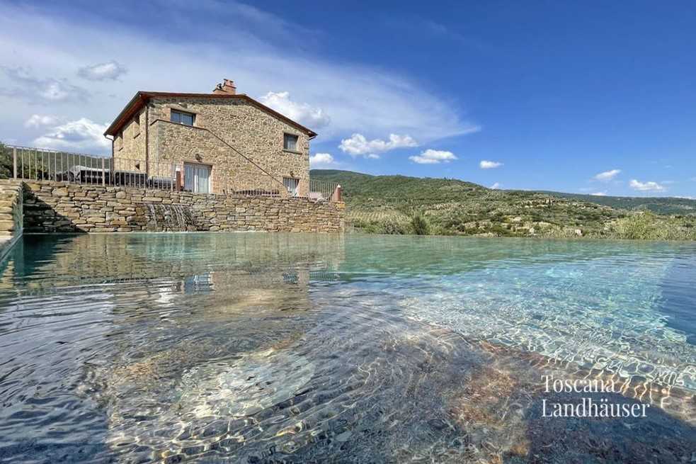 Photos Luxueux rustico avec piscine à débordement et vue panoramique